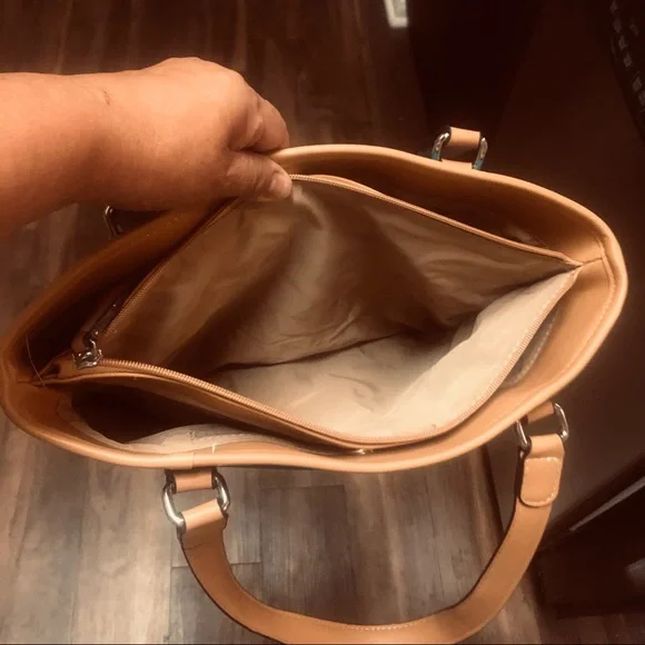 The turquoise bag has tan braided accent.  3 sections to hold your items. - Picture 5 of 5